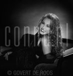 07-03-2000 Patricia Paay at studio in Amsterdam, by order of La Paay Cosmetics. March 07, 2000.

[keywords]Black & White Image, Posed, Eyecontact, Smiling, Sofa[/keywords]